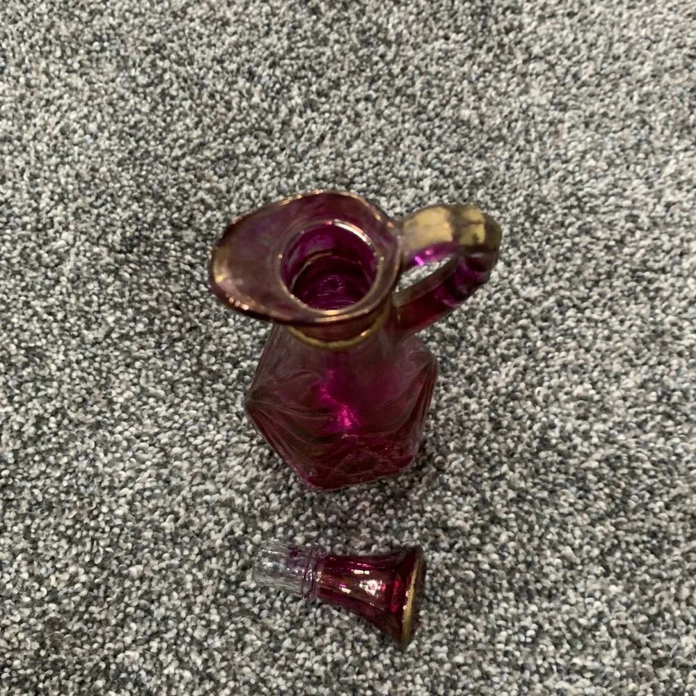 Glass pink and gold cruet